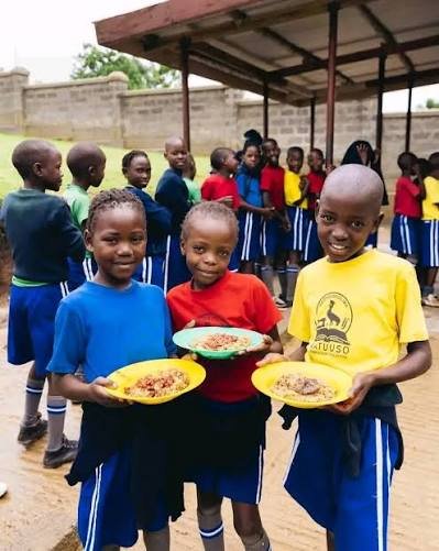 Children receiving learning materials