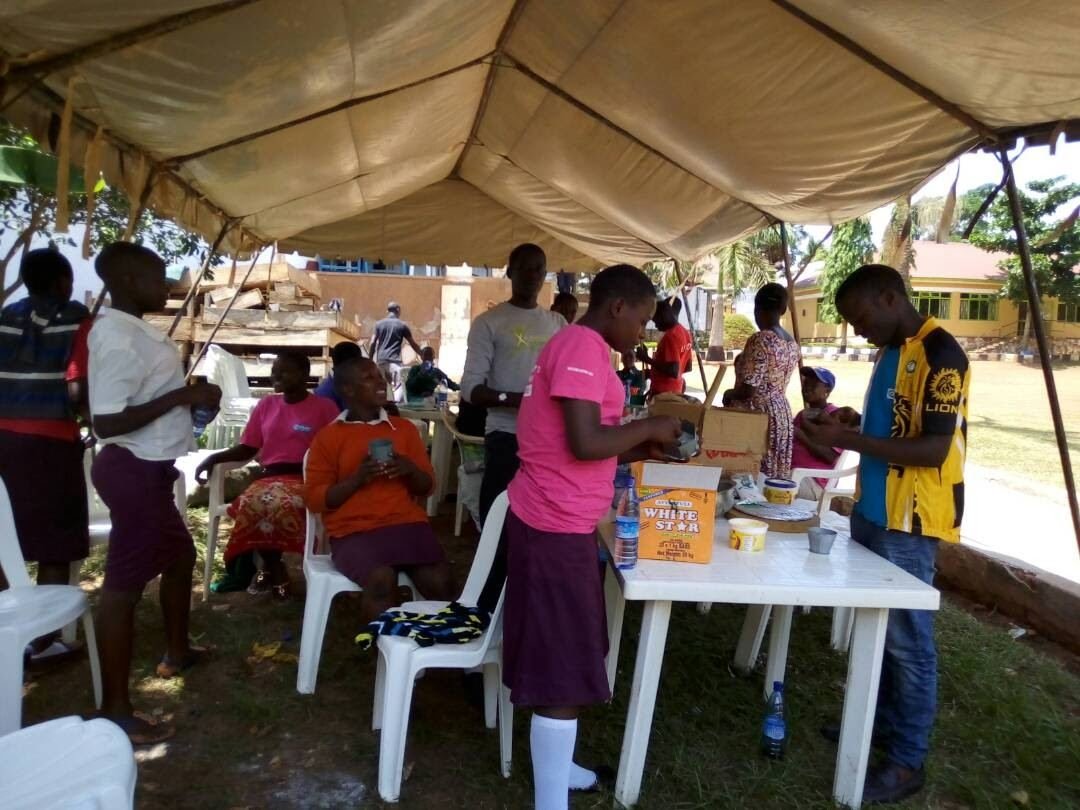 A community forum held under a tent